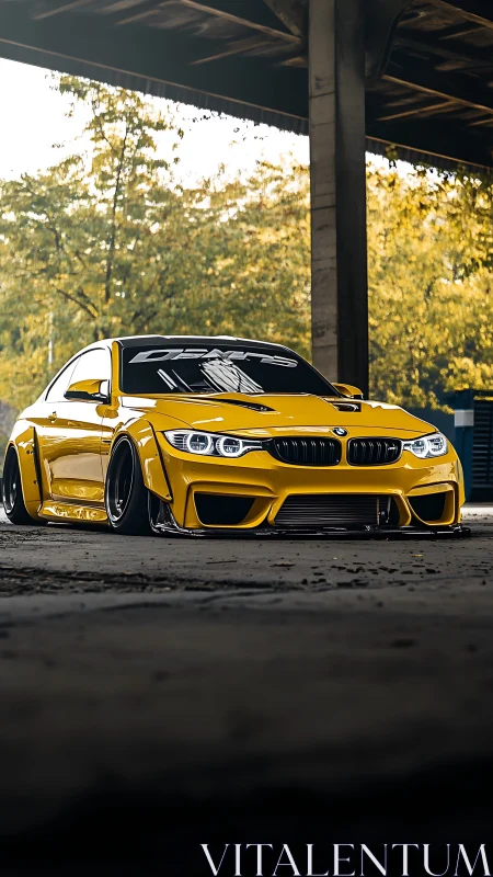 Lowered yellow sports coupe under industrial canopy in bokeh light