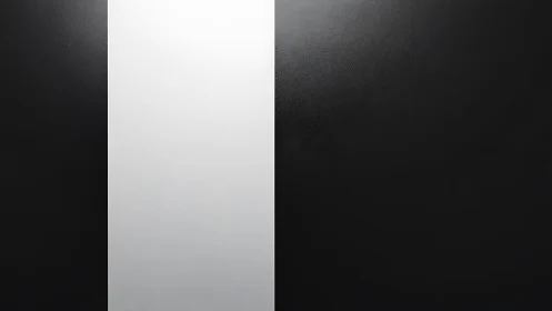 Monochrome corridor of light slicing through soft darkness.