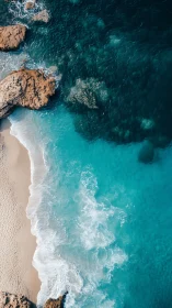 Soothing turquoise waves curling onto a quiet sandy cove.