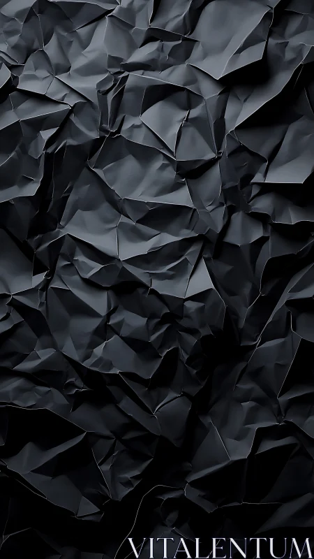 Midnight paper canyons in sculpted charcoal folds.