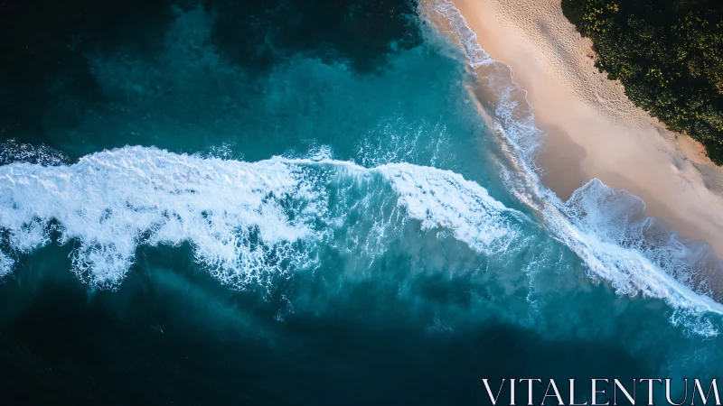 Aerial turquoise surf line curves along secluded shore.