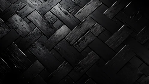Interlocking black planks in glossy geometric weave pattern.