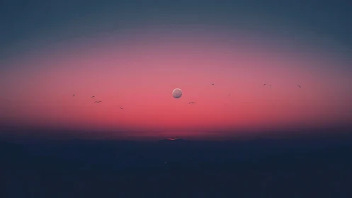 Soft twilight moonrise over distant violet mountains.