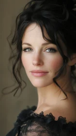 Portrait of woman with dark hair and lace garment detail.