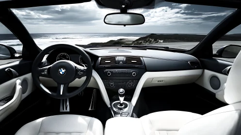 BMW car interior with ocean view through front windshield.