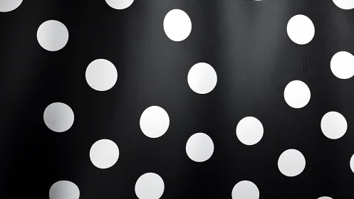 Black background with evenly spaced white polka dots.