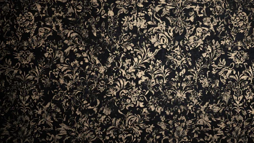 Ornate gold floral pattern gently glows on deep black