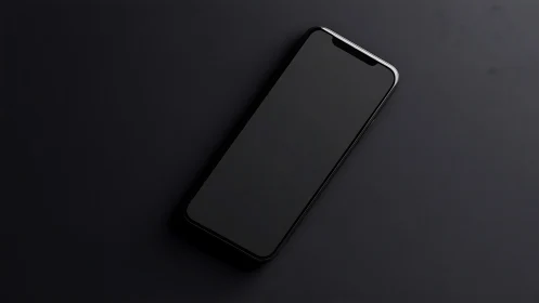 Minimalist Black Smartphone on Dark Surface.