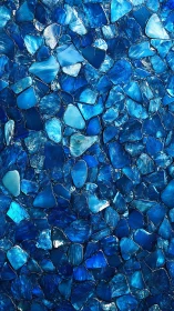 Shimmering blue glass mosaic captures ocean depth and calm