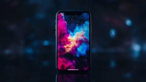 Smartphone displays vivid cosmic nebula against dark void