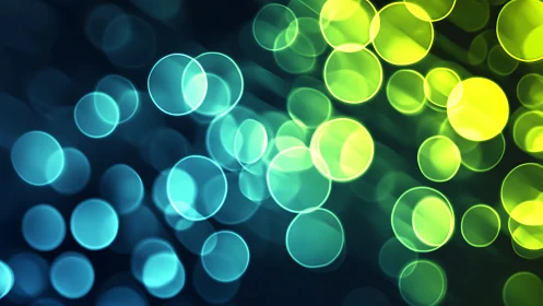 Glowing teal and lime bokeh lights in a dreamy soft blur.