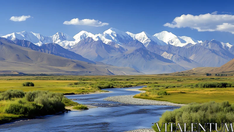 Snowcapped mountain range above winding alpine river valley.