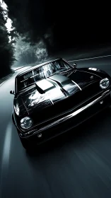 Black classic muscle car speeding on a dark forest road.