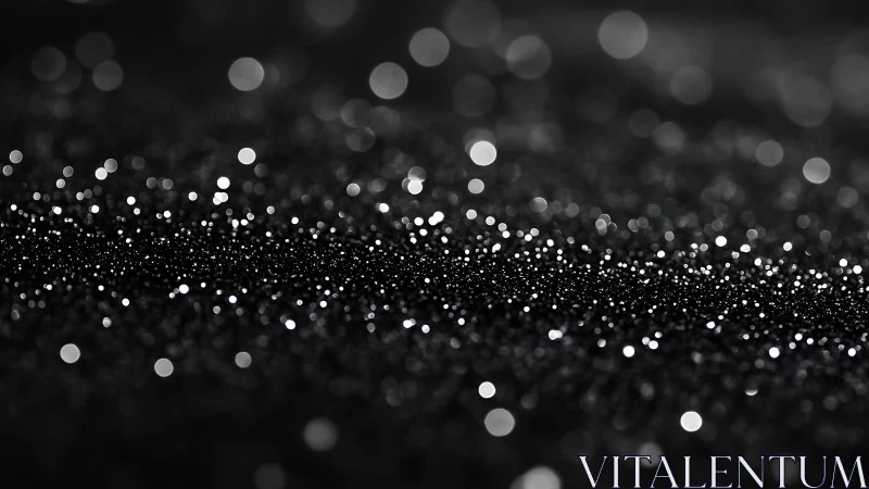 Black bokeh glitter field glows with soft luminous highlights.