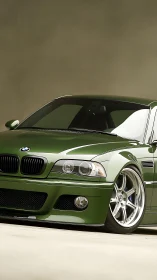 Deep green BMW coupe poised low, gleaming and road ready.