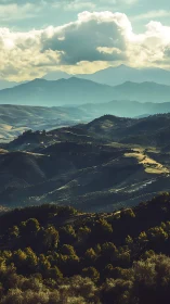 Layered mountain valley lies under dense afternoon clouds