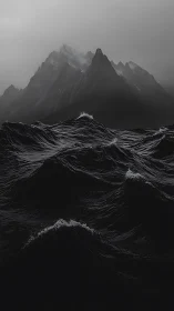 Brooding black waves courting a ghostly mountain crown.
