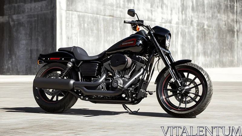 Black cruiser motorcycle parked on concrete surface outdoors.