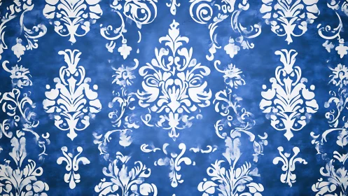 Ornate white damask stencil repeats on textured cobalt ground