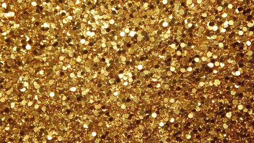 Dense surface of reflective gold confetti particles.