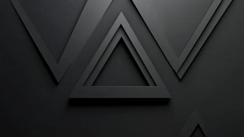 Layered black triangular geometric shapes on dark background.