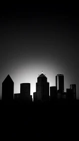 City spires carve a silver halo from the sleeping night sky