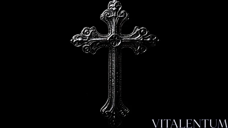Ornate silver cross quietly shines against deep black space