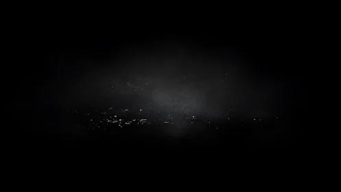 Silent halo of floating dust in a deep obsidian void.