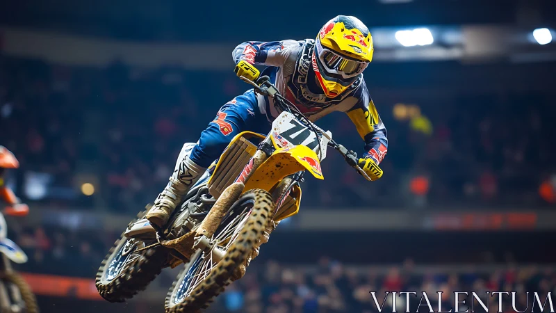 Stadium dirt rider launches into roaring floodlit air.