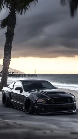 Midnight black muscle car cruising a moody beach road.