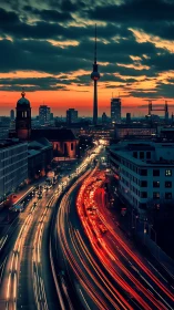 Nocturnal traffic light-trails beneath illuminated telecom tower.