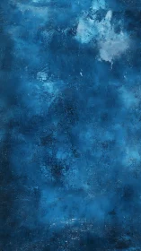 Deep blue textured abstract wall with subtle light bloom.