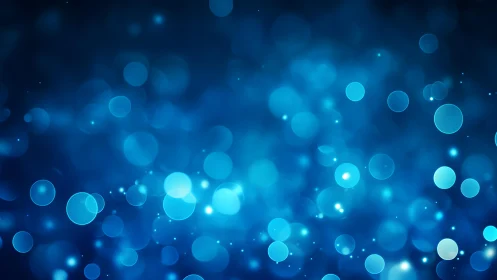 Abstract blue bokeh light background with soft glowing circles.