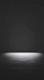 Isolated spotlight on dark wooden floor in empty space.