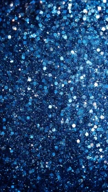 Deep blue glitter sparkles in a shimmering festive backdrop
