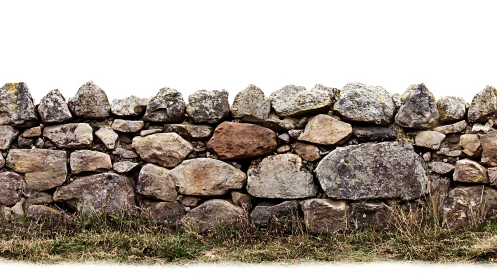 Dry stone boundary wall with irregular fieldstones isolated