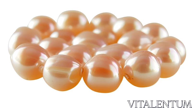 Lustrous peach pearls lie in a softly glowing clustered circle