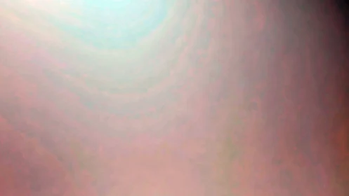 Soft pastel gradient drifts from warm pinks to cool light.