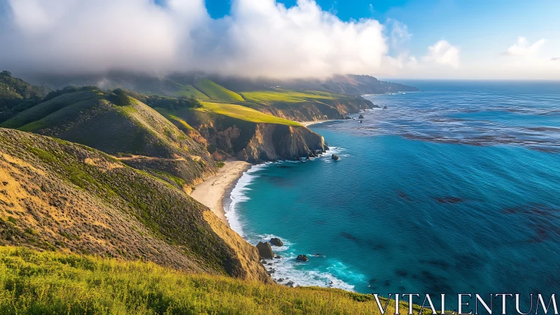 Coastal cliffs meet turquoise ocean with green hillsides and white sand beach.