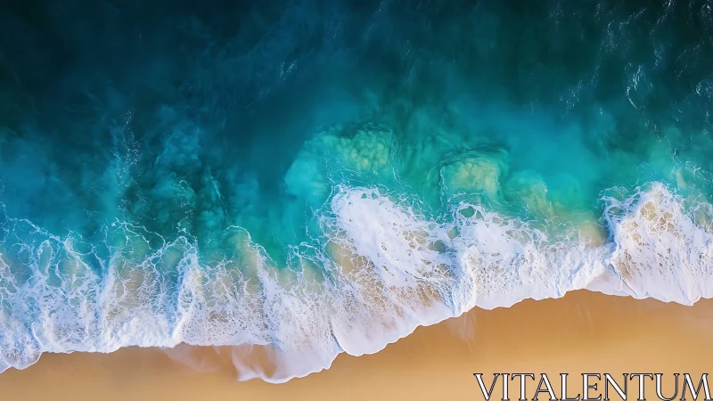 Turquoise surf curls over golden sand in aerial seascape.