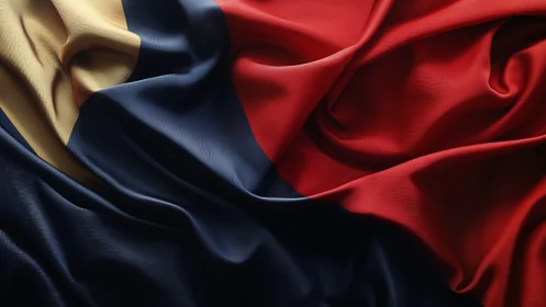 Tricolor flag fabric with deep folds in red, blue, gold.