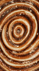 Caramel and cream spiral dessert texture in close view.