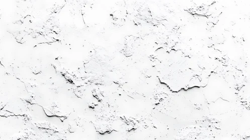 Textured white plaster surface shows irregular rough patches
