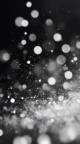 Glimmering light particles drift gently through soft darkness