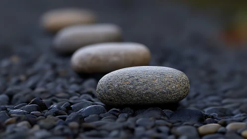 Smooth river stones aligned in tranquil shallow focus row.