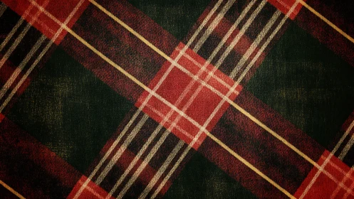 Warm red tartan fabric shows worn diagonal check pattern.