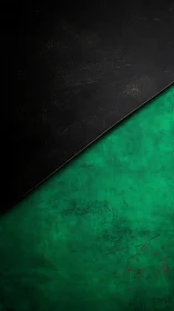 Diagonal midnight slab slices through weathered emerald field