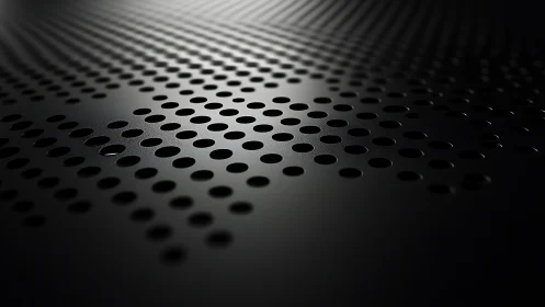 Subtle light glides across sleek perforated metal surface
