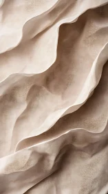 Waves of sheer beige fabric in soft sculptural folds.
