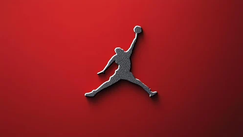 Elevated basketball jump silhouette on sleek red field.